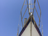 ships bow under a lovely blue sky at the harbor in rhodes city