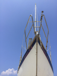 ships bow under a lovely blue sky at the harbor in rhodes city