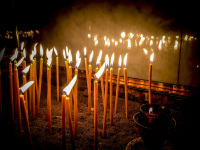 burning candles in the church of kremasti on rhodes