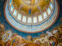 the colorful dome of the agios andreas church in patras with a golden chandelier