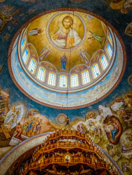 the colorful dome of the agios andreas church in patras with a golden chandelier