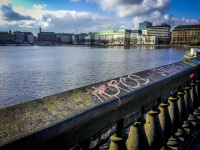graffiti on the lombardsbrücke in hamburg in front and behind you see the alster and the jungfernstieg