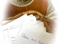 in a basket in the curch of profitis ilias on rhodes are laying written notes for praying