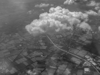view on loveley little clowds and under it is a landscape near hamburg in germany, black-and-white