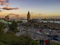 a view to the landungsbrücken in st. pauli in hamburg at sunsetligt