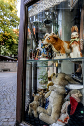 the store window of a toy shop with antique toys in the old town of rothenburg ob der tauber in germany
