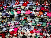 a pile of colorful knotted carpets in kalavrita in greece