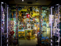 a lighted store in san marino in italy with many souvenirs