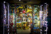 a lighted store in san marino in italy with many souvenirs