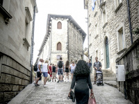 an elegant italian women is going up a street in san marino in italy