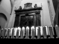 electric candles in the church santa maria assunta in bovino in italy, black-and-white