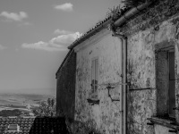 an old wheathered house with a view in the landscape around the village bovino in puglia, black-and-white