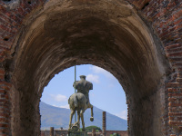 view through a wall vault to the statue of centaur in pompeii near naples in italy