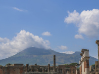 in the front you see a part of pompeii and in the background the vesuv near naples in italy