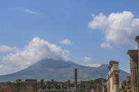 in the front you see a part of pompeii and in the background the vesuv near naples in italy