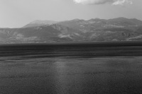 a panoramic view on the gulf of corinth and the mountains near delphi on the other side, black-and-white