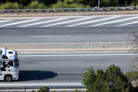 you see the truck cab of a white truck that is driving on the highway near diakopto in achaia