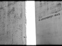 with the date 13. december 1943 signed memorial stones at the memorial in kalavrita in greece, black-and-white