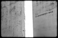 with the date 13. december 1943 signed memorial stones at the memorial in kalavrita in greece, black-and-white