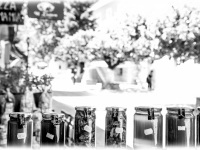 glasses with homemade honey for sale in the streets of kalavrita, black-and-white