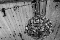 in rhodes city a net full of snales are hanging on a market for sale, black-and-white