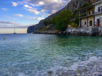 the turquoise sea in the bay of gerolimenas in a loveley evening light