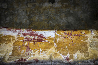 a weatherde wall in eleousa on rhodes looks like a painint in yello, white, grey and red