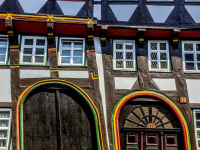 a half-timbered  house with two aslant doors and five windows in einbeck in germany