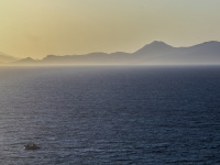 a view from monte smith on rhodes over the sea to the turkish coast in a loveley evening light
