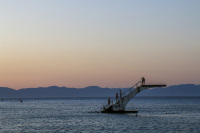 the diving plattform in the sea at the elli beach in rhodes city by sunsetlight