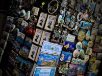a rotating goods rack in san marino is equipped with many souvenir magnets