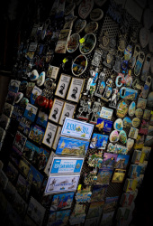 a rotating goods rack in san marino is equipped with many souvenir magnets
