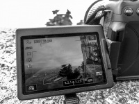 through the display of the canon eos 70D you see the landscape around san marino in italy, black-and-white