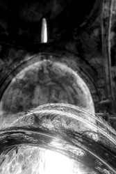 peacock feathers in front of the frescoes of the agios nikolaos fountoukli church in eleousa on rhodes, black-and-white
