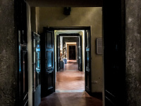 a corridor with big open doors in th diocesan museum in bovino in puglia