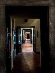a corridor with big open doors in th diocesan museum in bovino in puglia