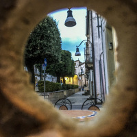 through a bagel of the osteria ndo\' save\'rie lu conte in bovino you look to the footpath next to the restaurant