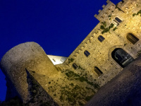 the loveley iluminated castle of bovino with a darkblue night sky in bovino in puglia