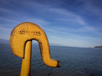 the handle of a wooden shepherd\'s stick which is signed with \"Ioannina\" you see in front of the blue gulf of corinth in diakopto