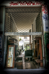 in a small backyard in monastiraki in athens furniture are presented for sale