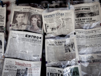 in plastic bags keeping antique newspapers are offered in a shop in monastiraki in athens