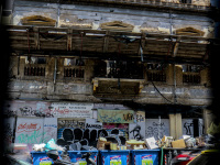 a ruin between other buildings in monastiraki in athens