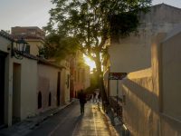 an empty alley in plaka in athens in the backlight of the evening sun