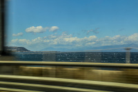 the gulf of corinth with many waves out of the carwindow while driving