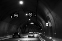 in a tunnel on the highway 5 near gavrolimni in greece with some cars in front, black-and-white