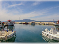 boats at the harbor of arkitsa in central greece