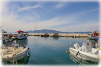 boats at the harbor of arkitsa in central greece
