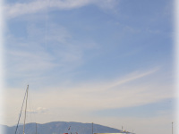 coloful fisherboats are laying like a line between the sky and the sea in arkitsa