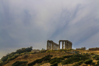 kap sounion on the hill under a clowdy sky