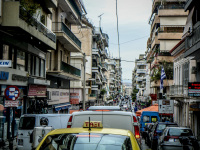 view in a street with much traffic in piraeus in athensthens